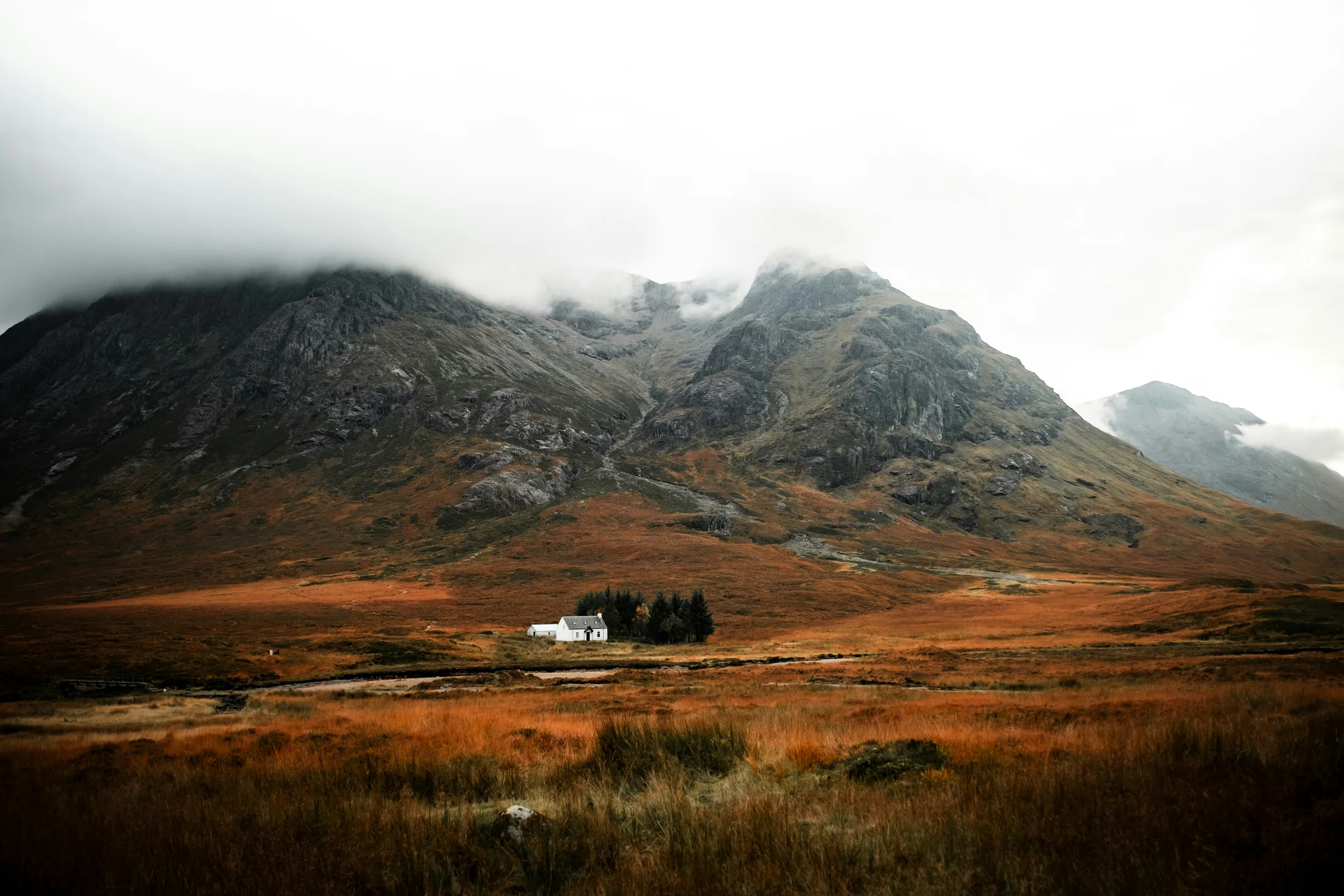 Remote Highland cottage in Glen Coe beneath steep mountains