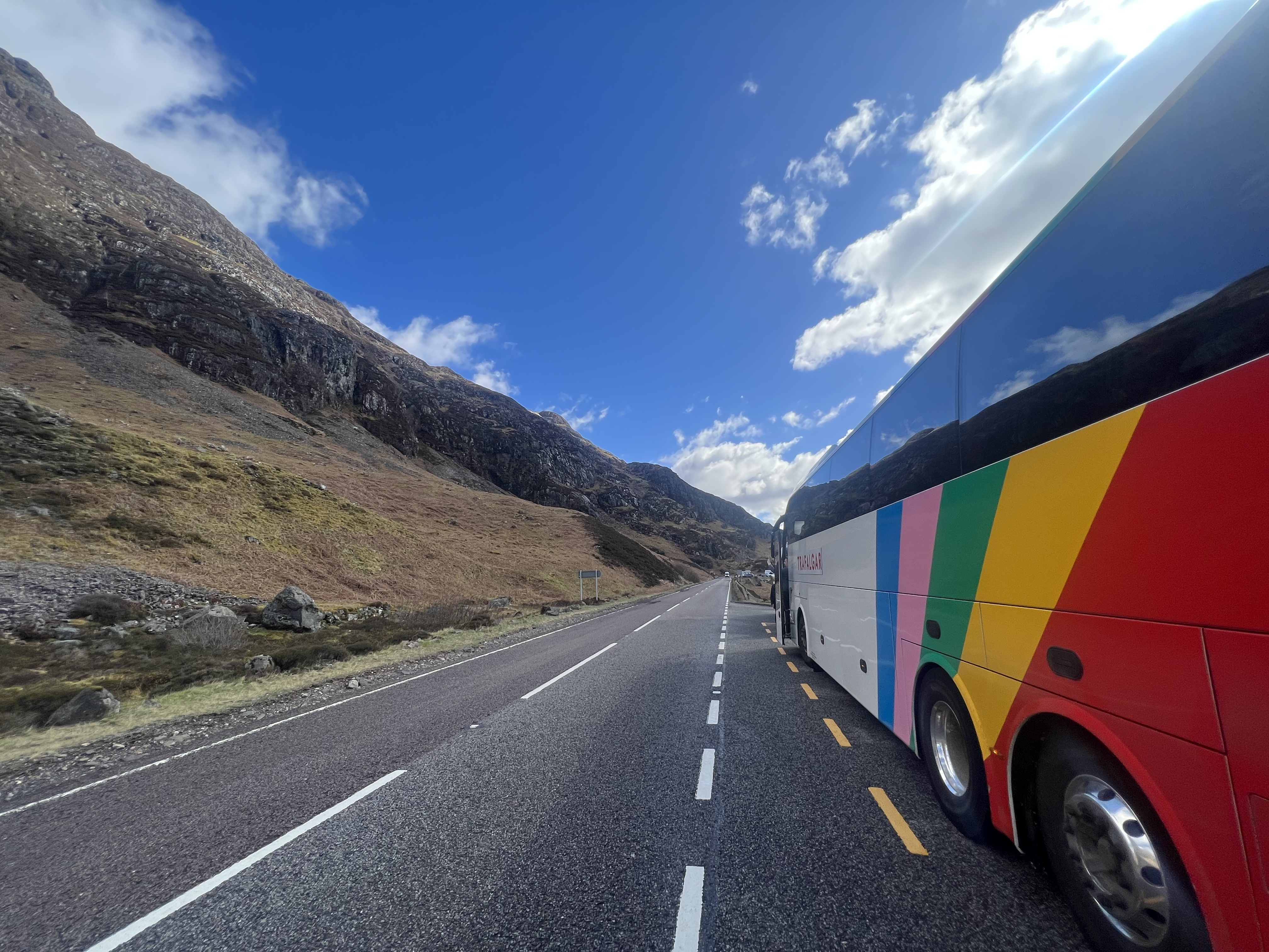 Coach travelling through Glencoe in the Scottish Highlands