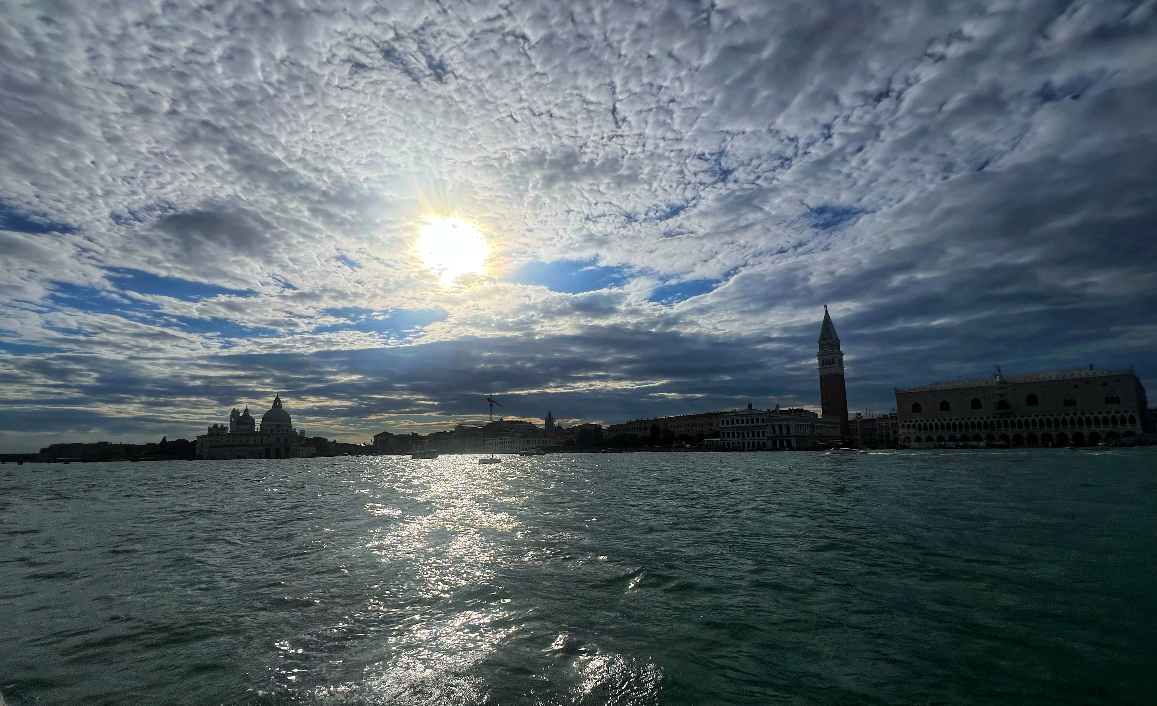 Venice skyline across the water under dramatic cloud and light