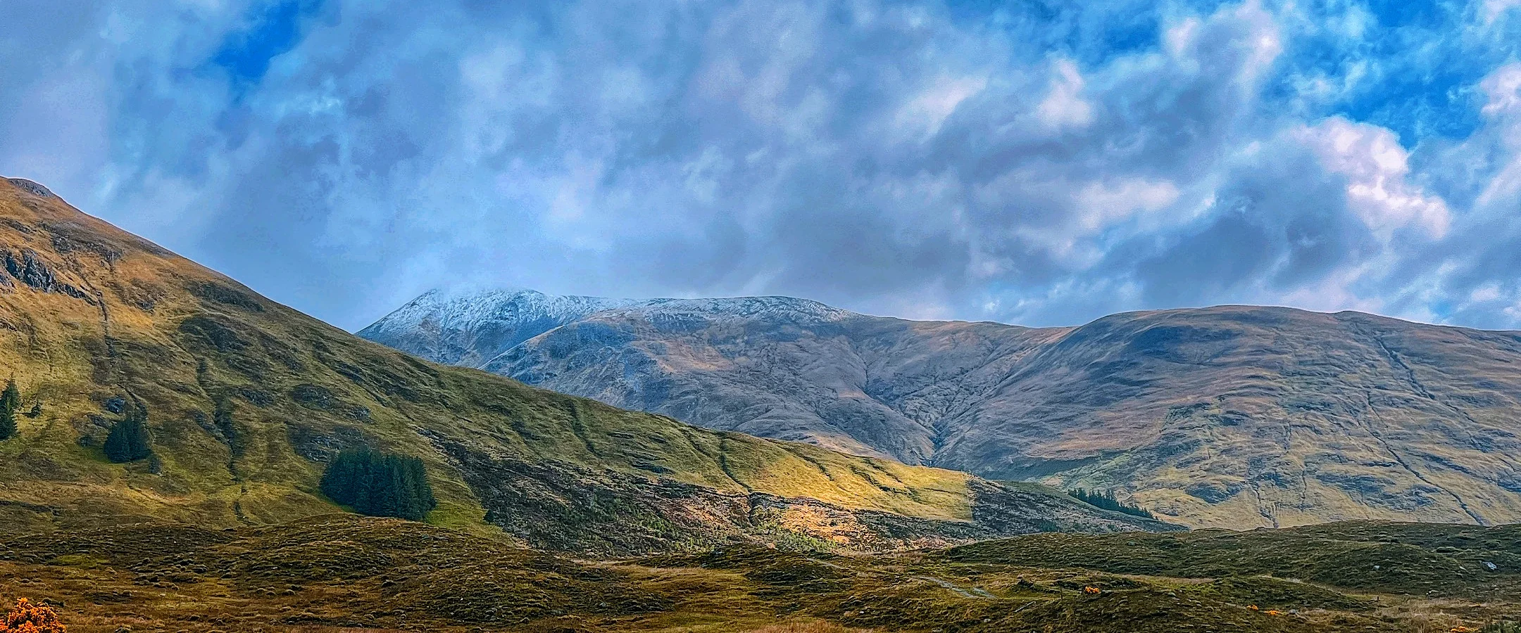 Scottish Highlands landscape under dramatic sky