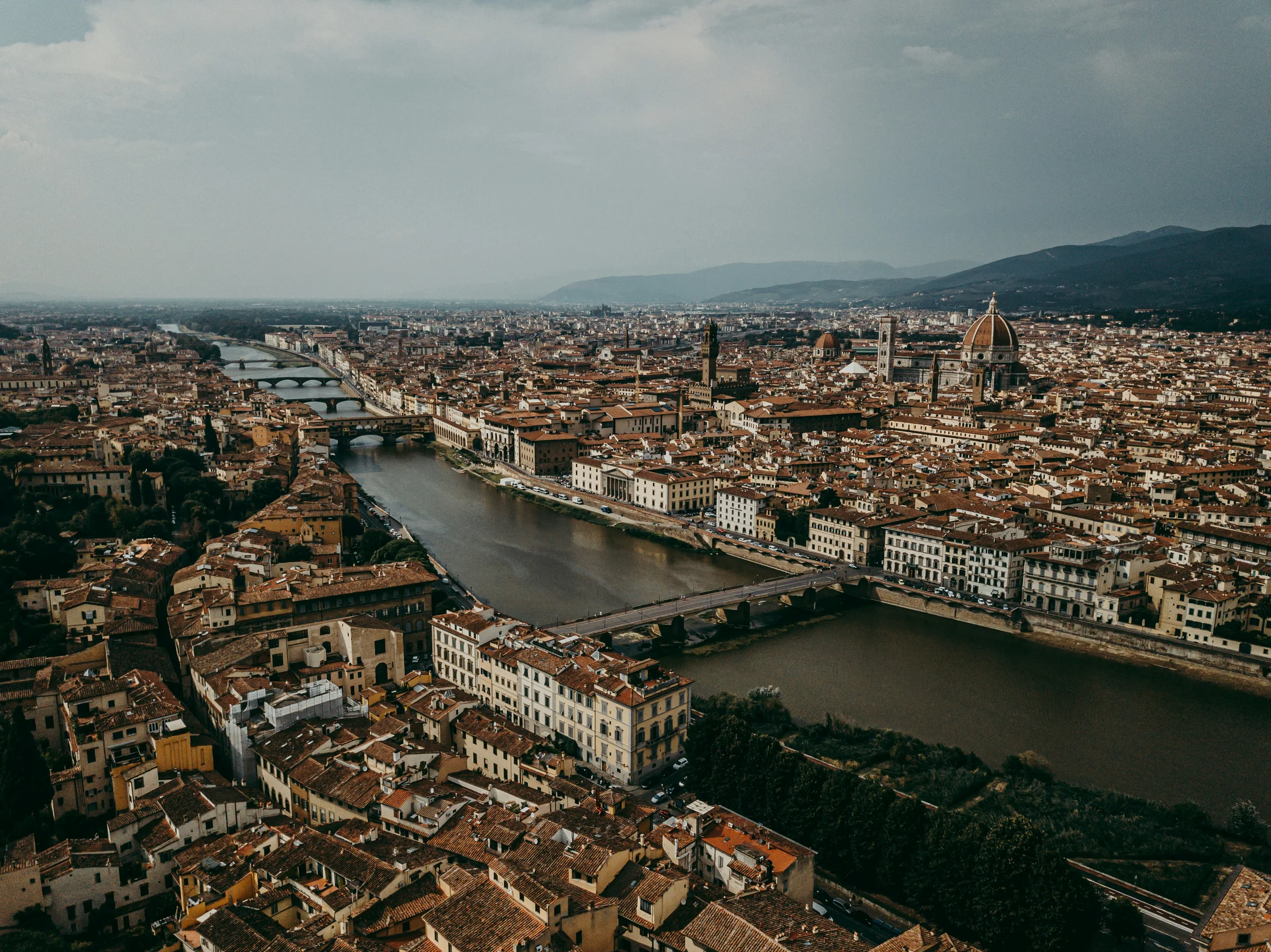 Florence skyline at sunset with the Duomo and Arno River